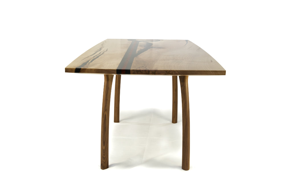 Silver maple, African Padauk and epoxy dining table with modern black walnut legs. 
