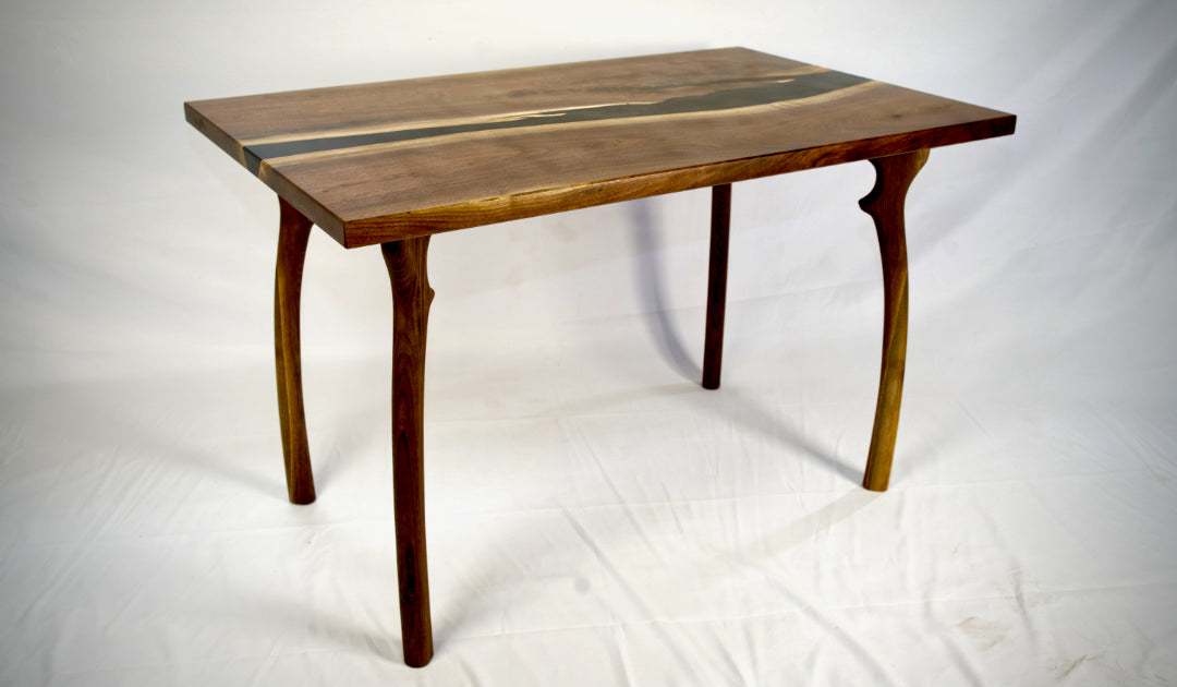 Small Black walnut dining table with pure black epoxy river. Lightwood Designs, custom woodworking, home décor, office décor, gift, wedding gift, anniversary gift, custom engraving, Elora, Ontario, Handmade, Local