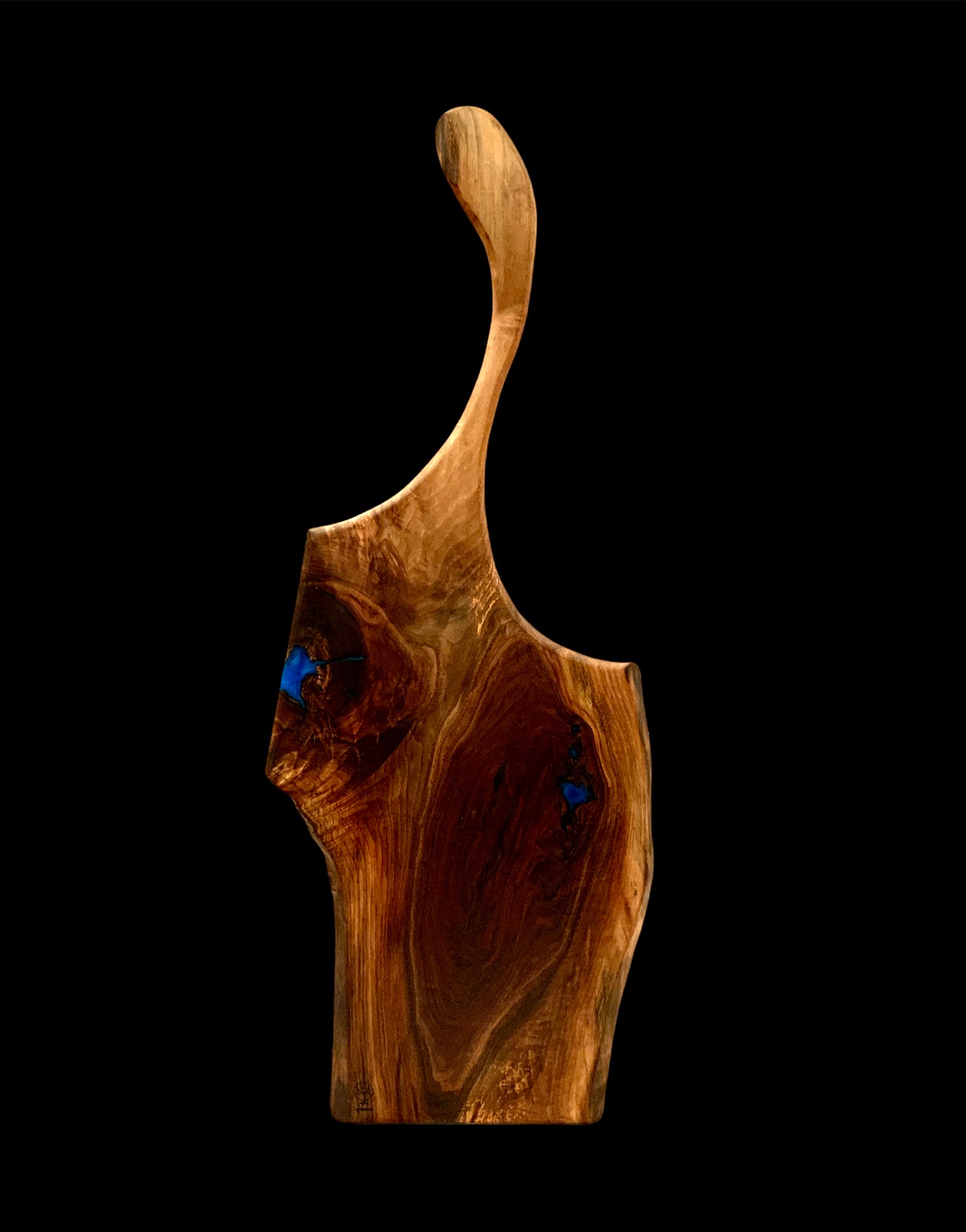 Handmade Black Walnut charcuterie board with blue epoxy highlights. Lightwood Designs